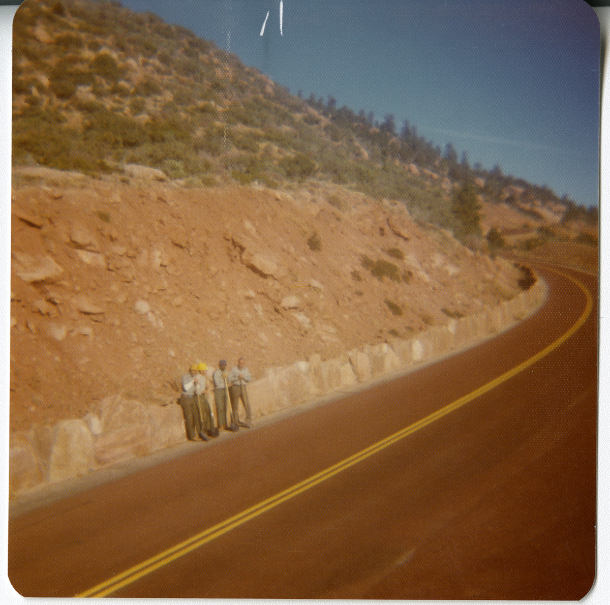 Men standing with shovels on the side of the road during road repair on Kolob Canyon Road.