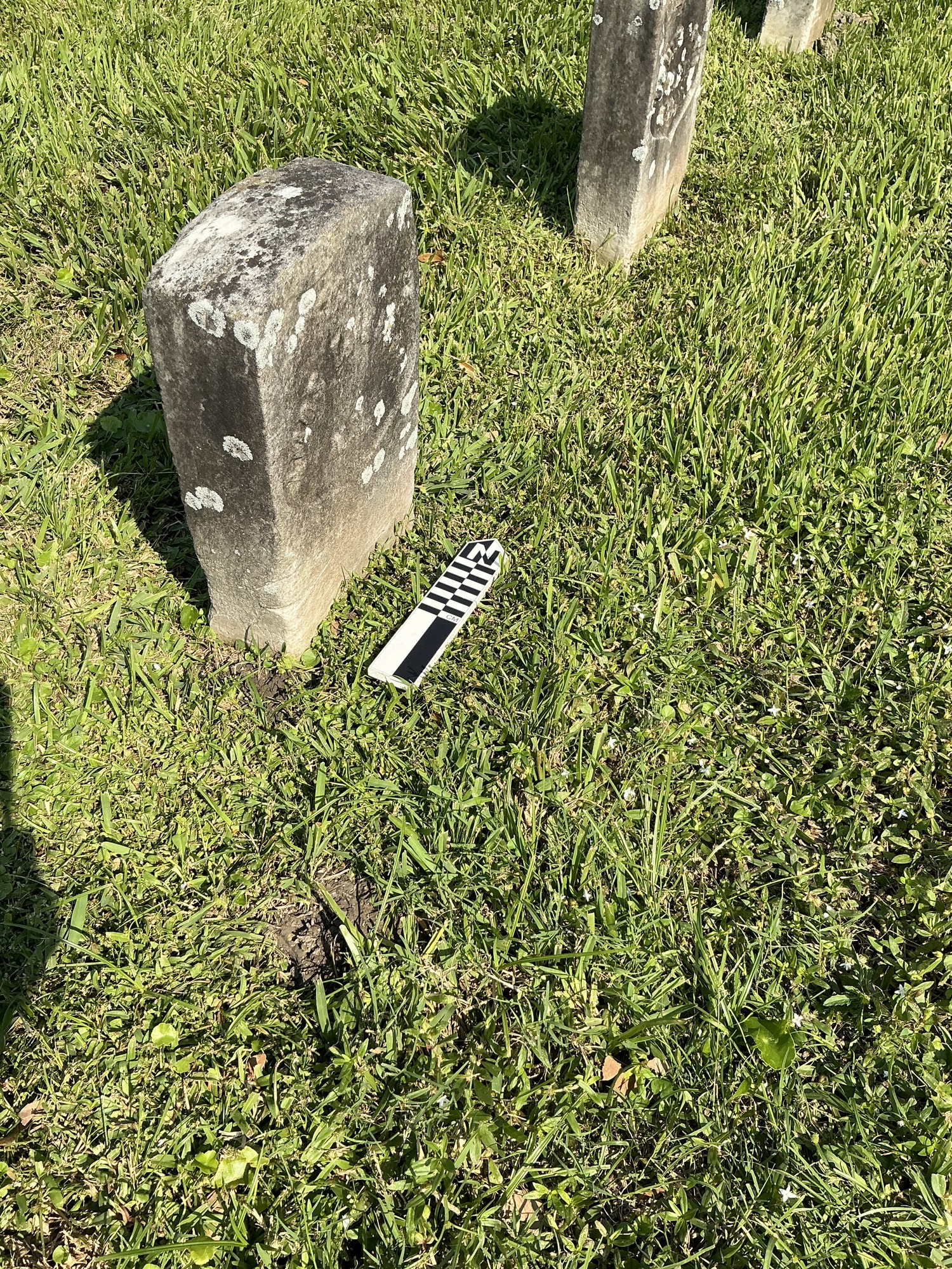 Extra image of historic upright marble headstone with recessed shield face.