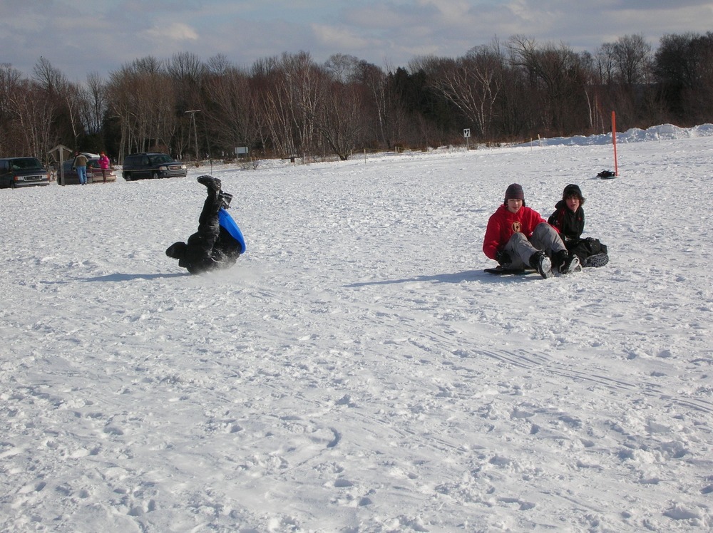 A typical ending of a sledding run on the Dune Climb.