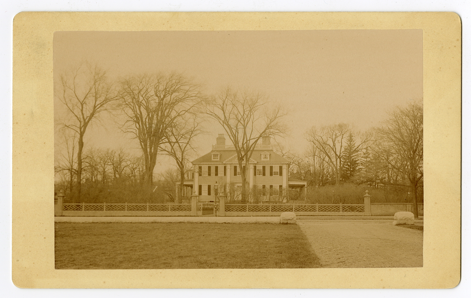 Albumen print of facade of Georgian mansion, taken from across the street.