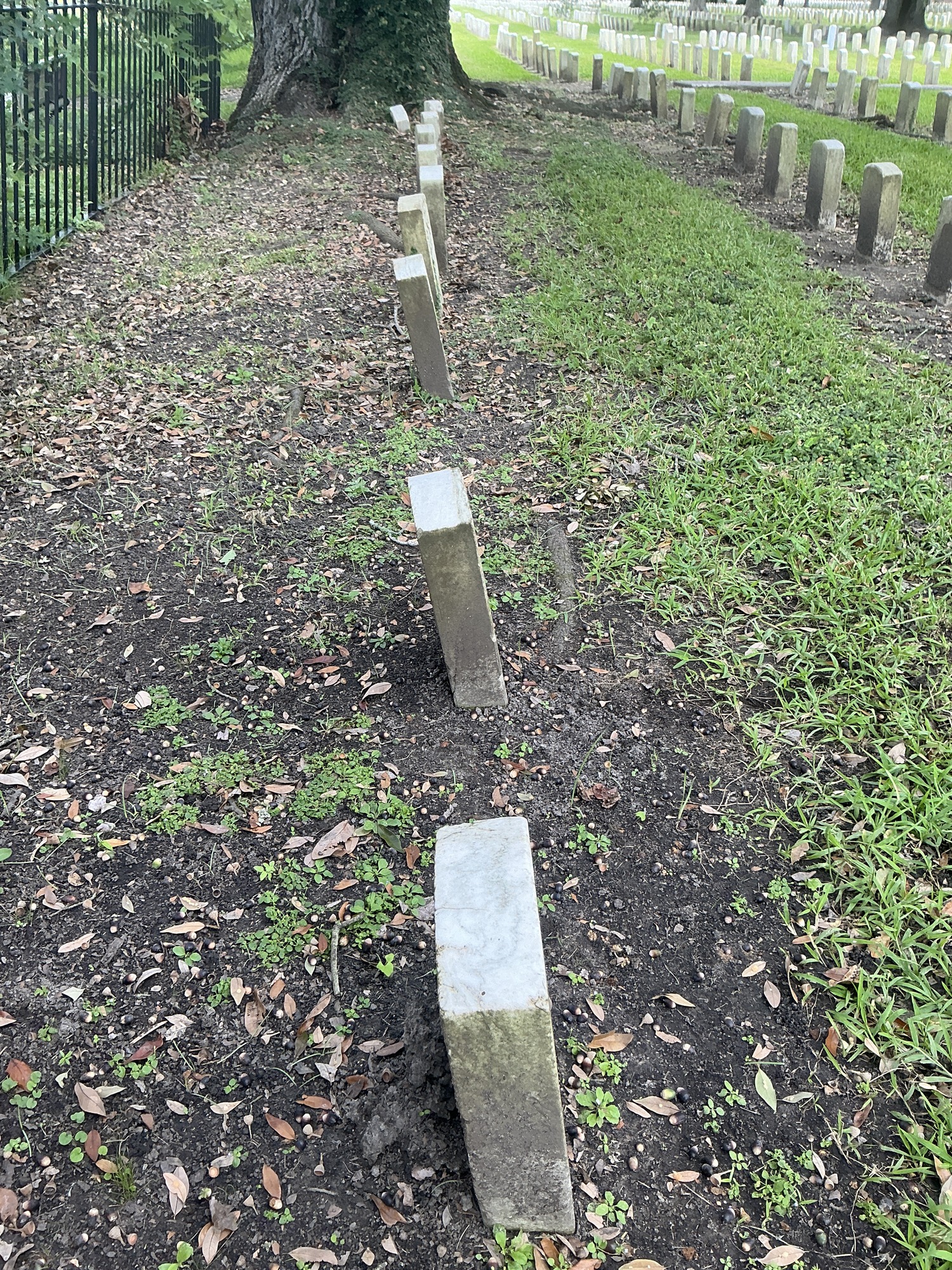 Extra image of historic upright marble headstone with recessed shield face.