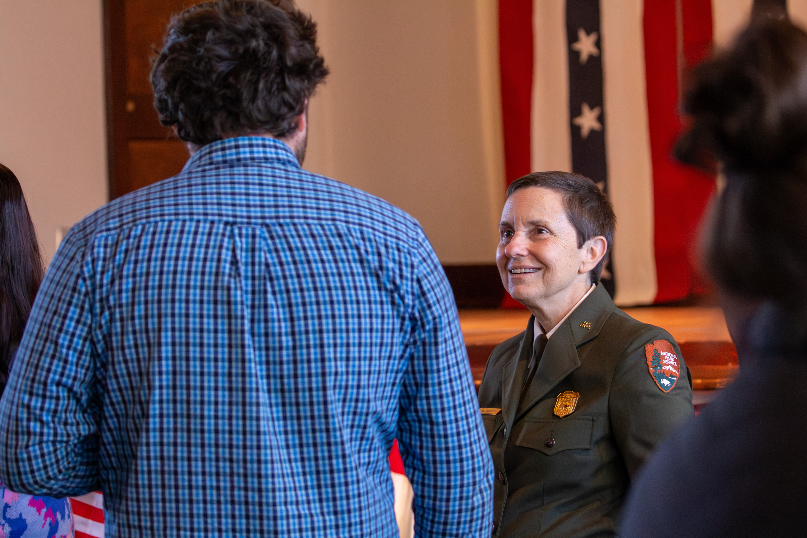 Man and park superintendent Jill Stuckey standing and talking.