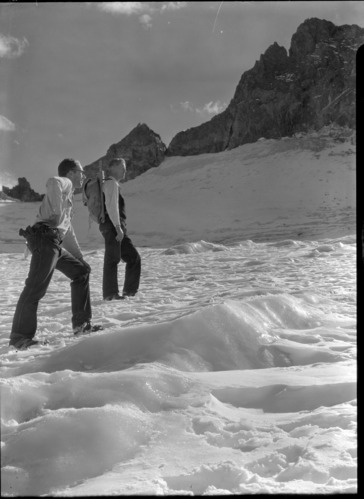 Bert Herwell, Park Naturalist and Ed Beatty, Assist. (on the left) on the 1934 glacial survey on the east lobe of the Lyell glacier. Photo used as #7 in the 1934 glacial survey report.