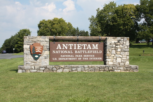 Stone and wood sign for Antietam National Battlefield with NPS arrowhead