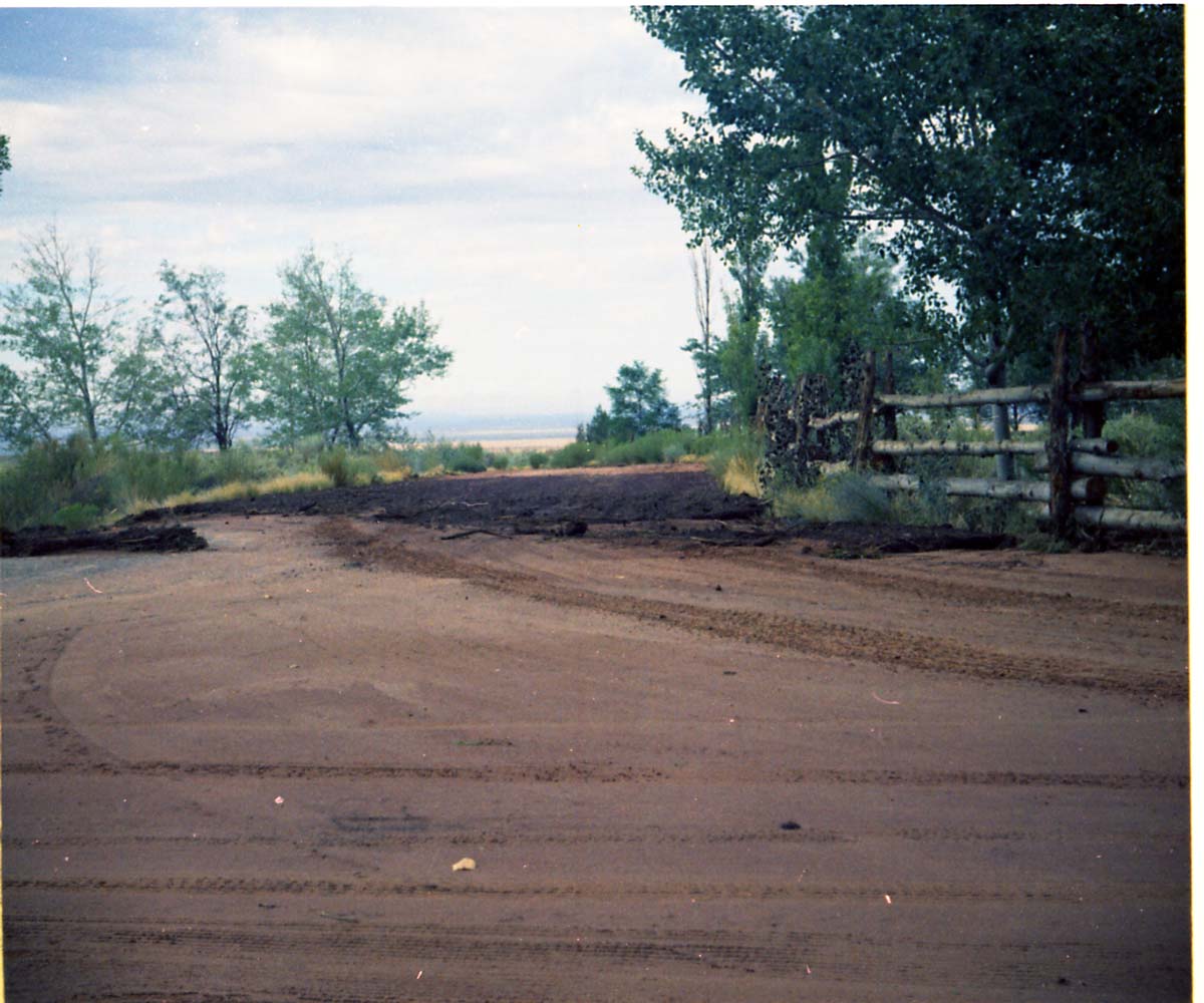 Color photo of flood damage at Pipe Spring National Monument.