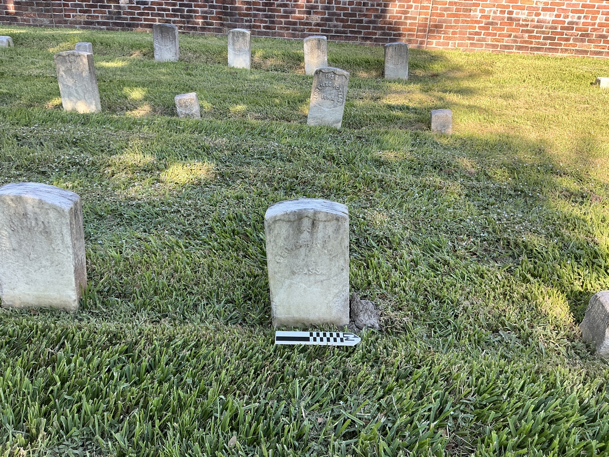 Extra image of historic upright marble headstone with recessed shield face.
