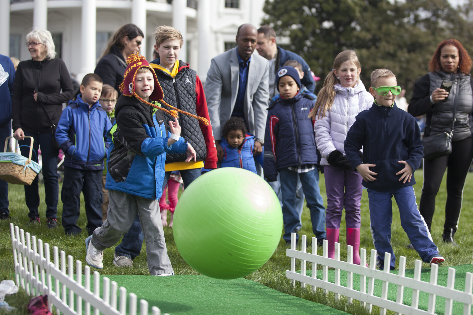 Children participate in a new Easter Egg Roll activity: bowling. 