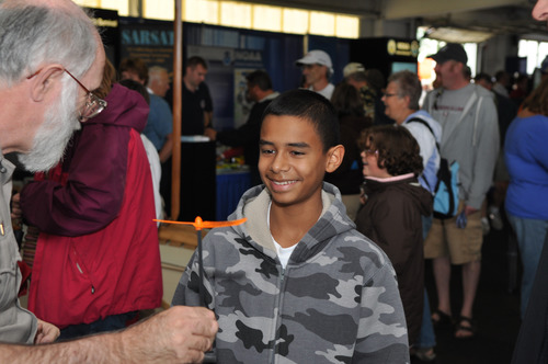 Boy learning about aviation at an educaiton outreach event
