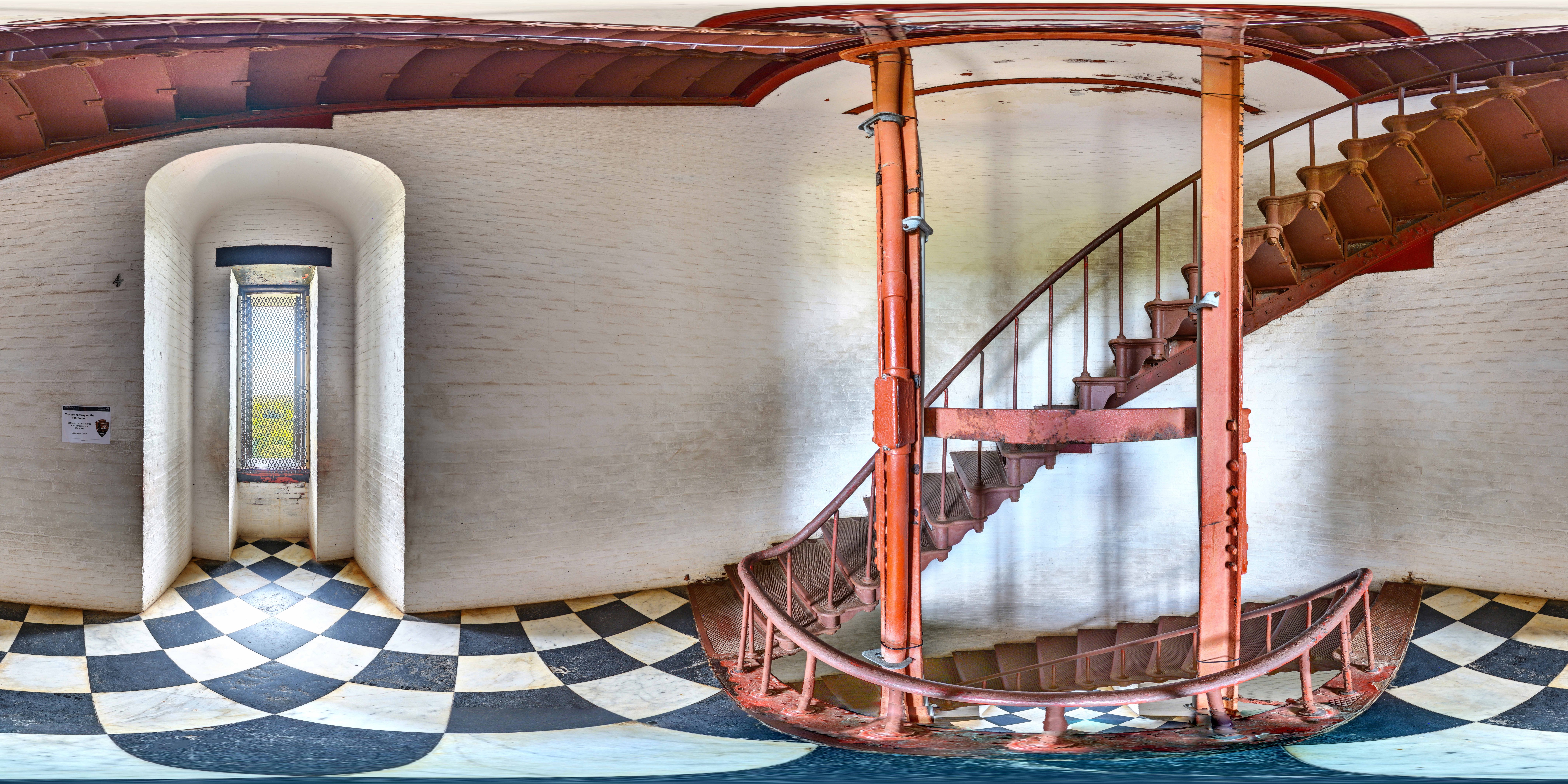 Landing and window on the red spiral staircase of lighthouse