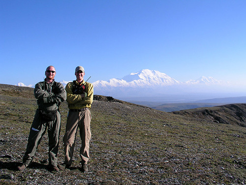 proud crew members pose in front of lands they helped preserve 