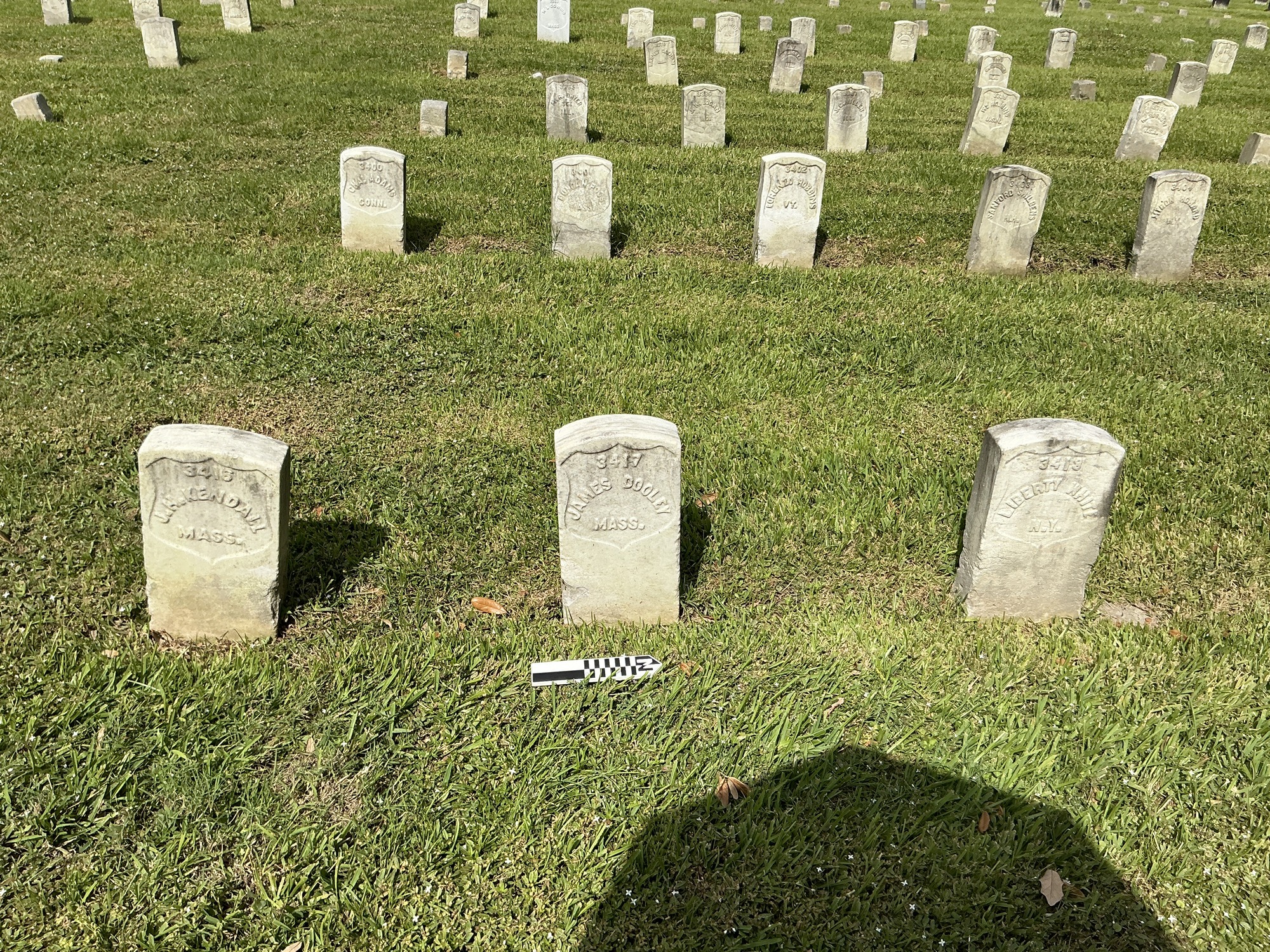 Extra image of historic upright marble headstone with recessed shield face.