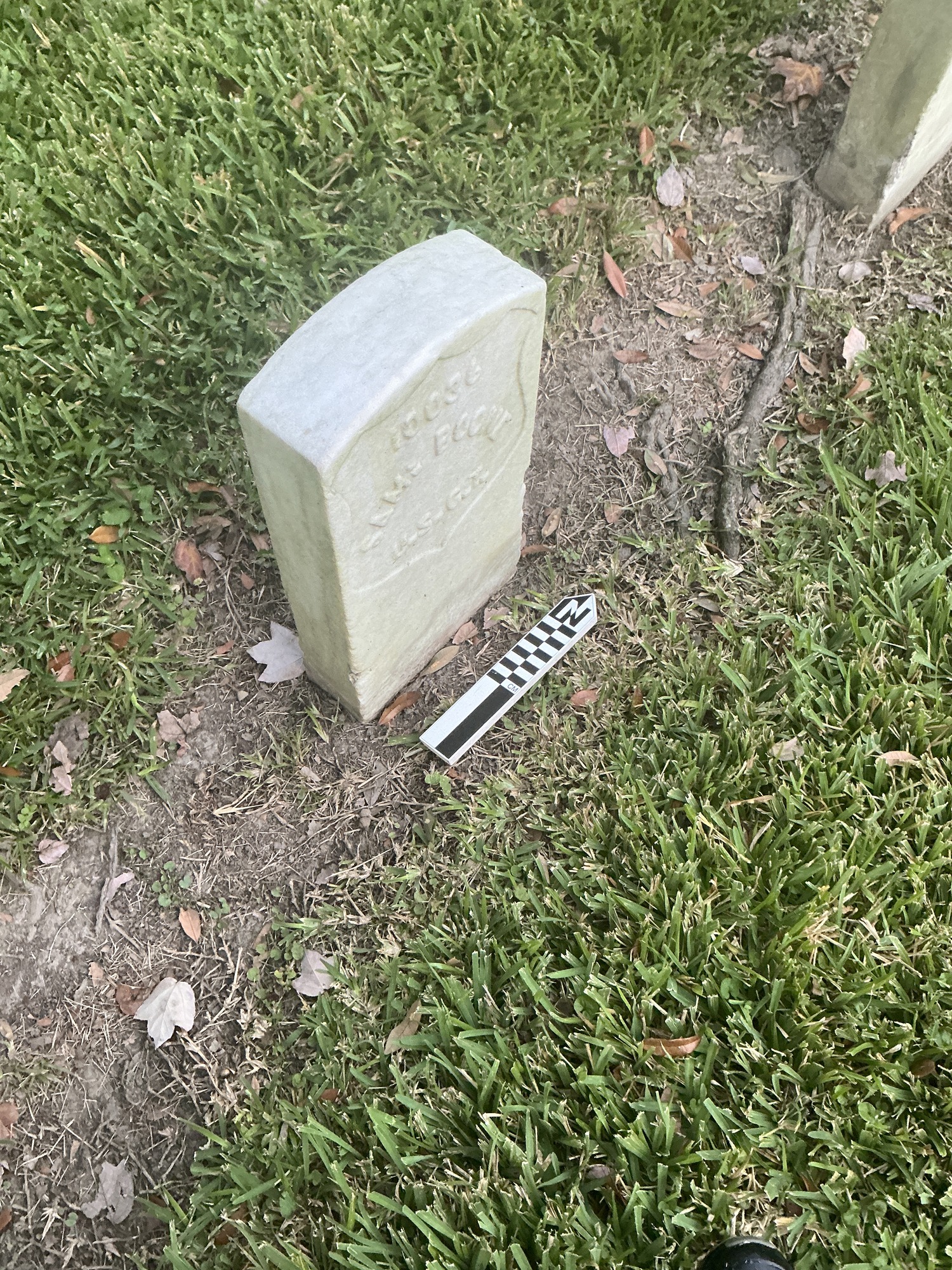 Extra image of historic upright marble headstone with recessed shield face.