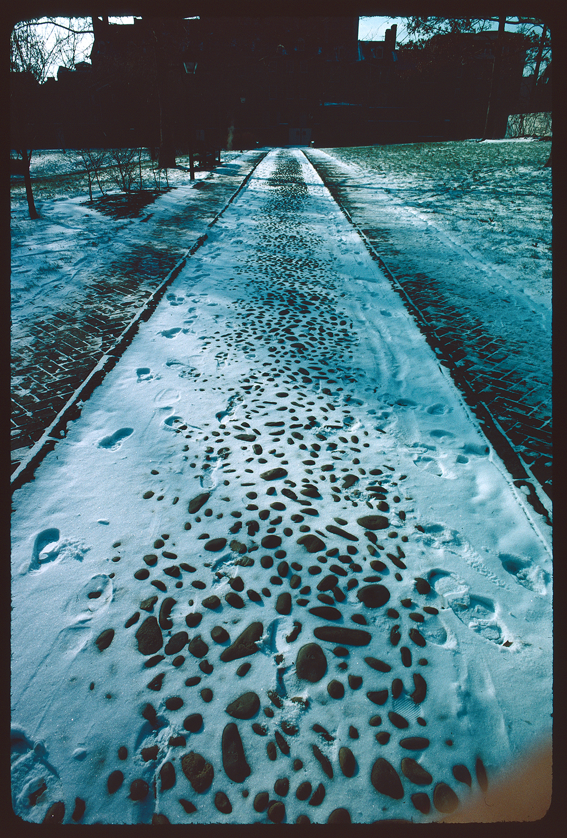 Hudson's Alley. Looking down southwest towards Walnut Street houses. Snow on cobblestones.