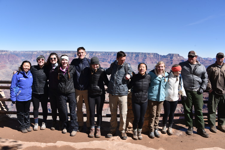 12 individuals standing at the South Rim.