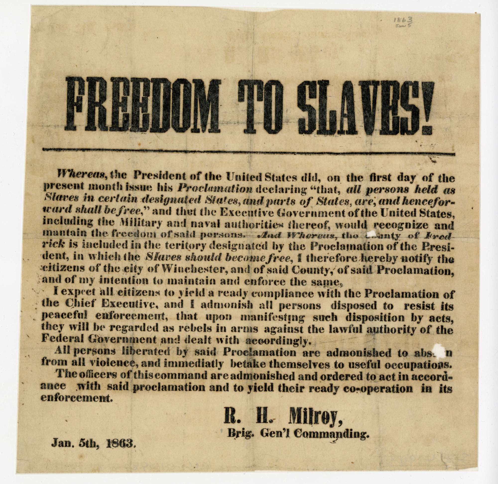 A weathered paper notice from 1863 proclaims freedom to slaves.