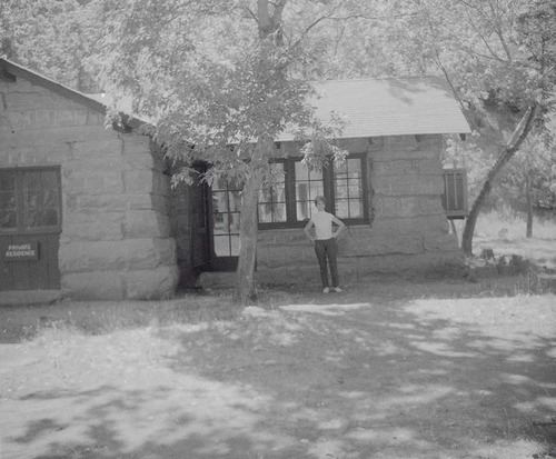 Woman standing in front of the Grotto building.