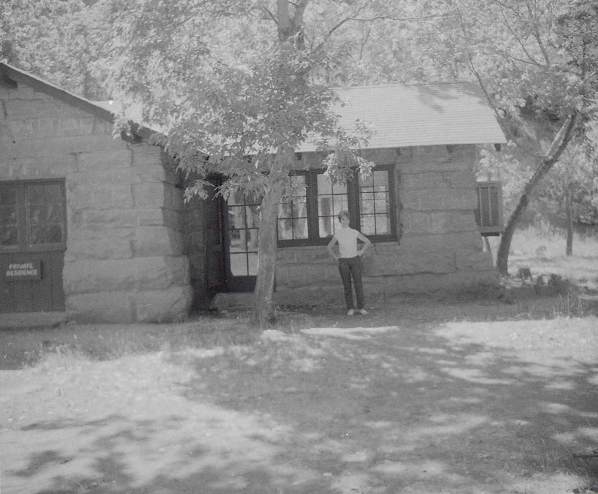 Woman standing in front of the Grotto building.