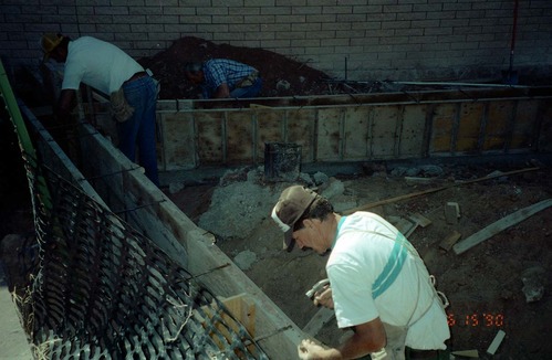 Workers during the construction of headquarters addition.