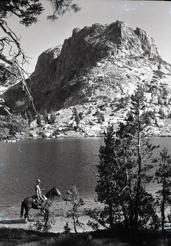 Art Holmes on horseback.