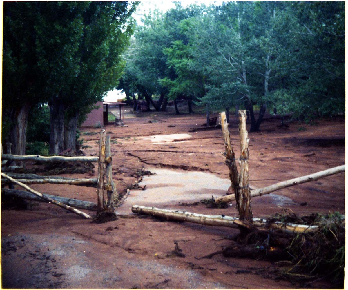 Color photo of flood damage at Pipe Spring National Monument.
