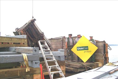 Dock construction using barge at Tookers Island, Isle Royale, 1999