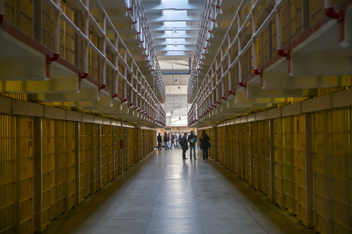 People in the hallway of the cell block