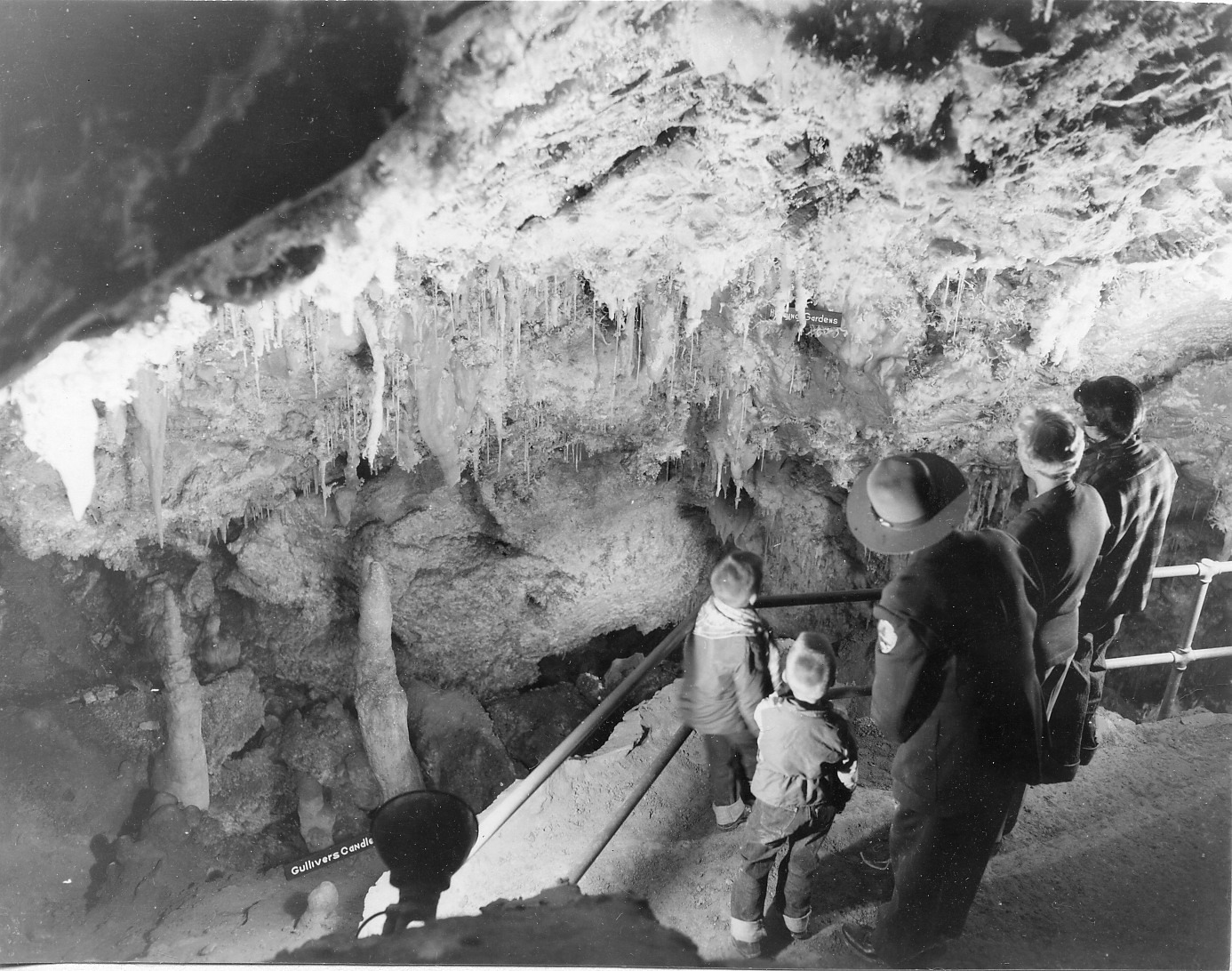 A park ranger with a small group inside the cave.