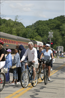 Cuyahoga Valley Scenic Railroad, Bikers Waiting to Board Train. In 2007 CVSR and NPS launched Bike Aboard!service to encourage use of the railroad as alternative transportation. For a $2 fare cyclists can ride the train in one direction and bike the other along the Ohio & Erie Canal Towpath Trail. Some images are at Rockside Station and others in Peninsula near the Peninsula Depot.