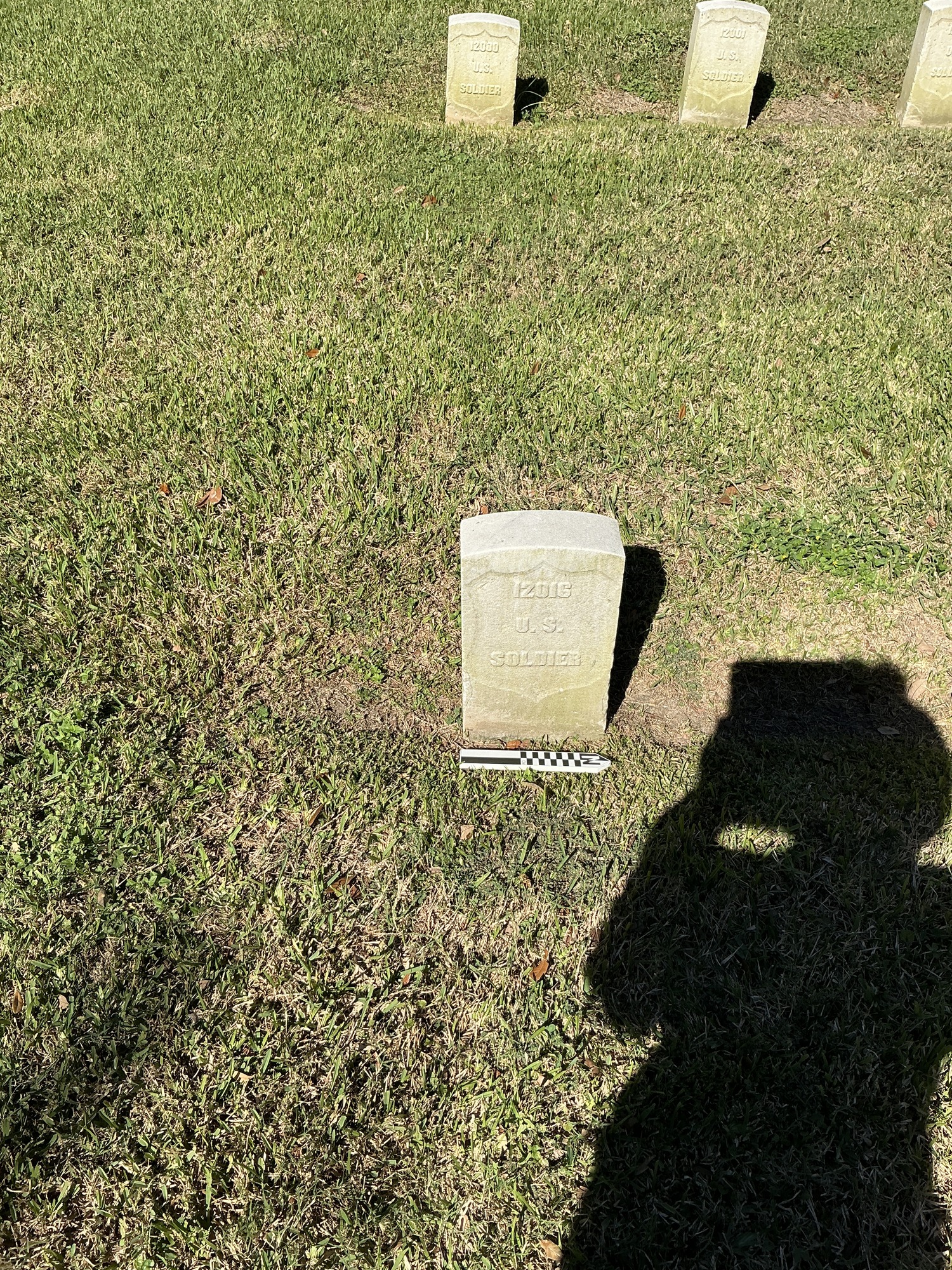 Extra image of historic upright marble headstone with recessed shield face.