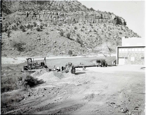 Parking area construction at rear of new Mission 66 Visitor Center and Museum for employee parking.