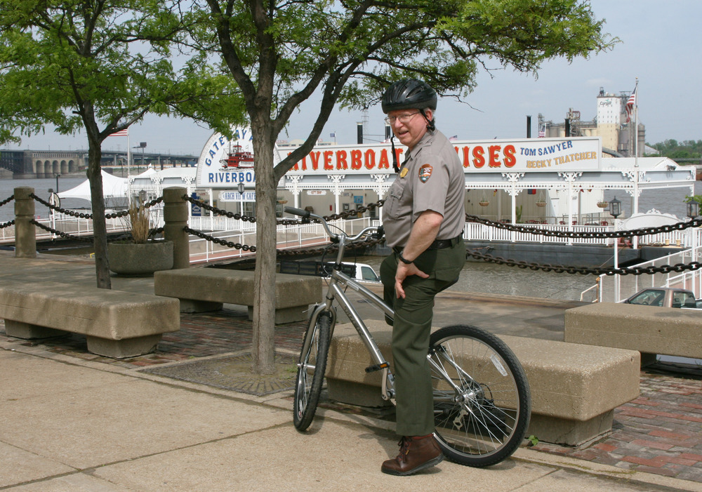Ranger sitting on bike along the Riverfront
