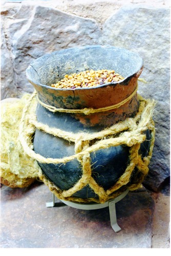Color photos of prehistoric jar (North Creek Gray) display.