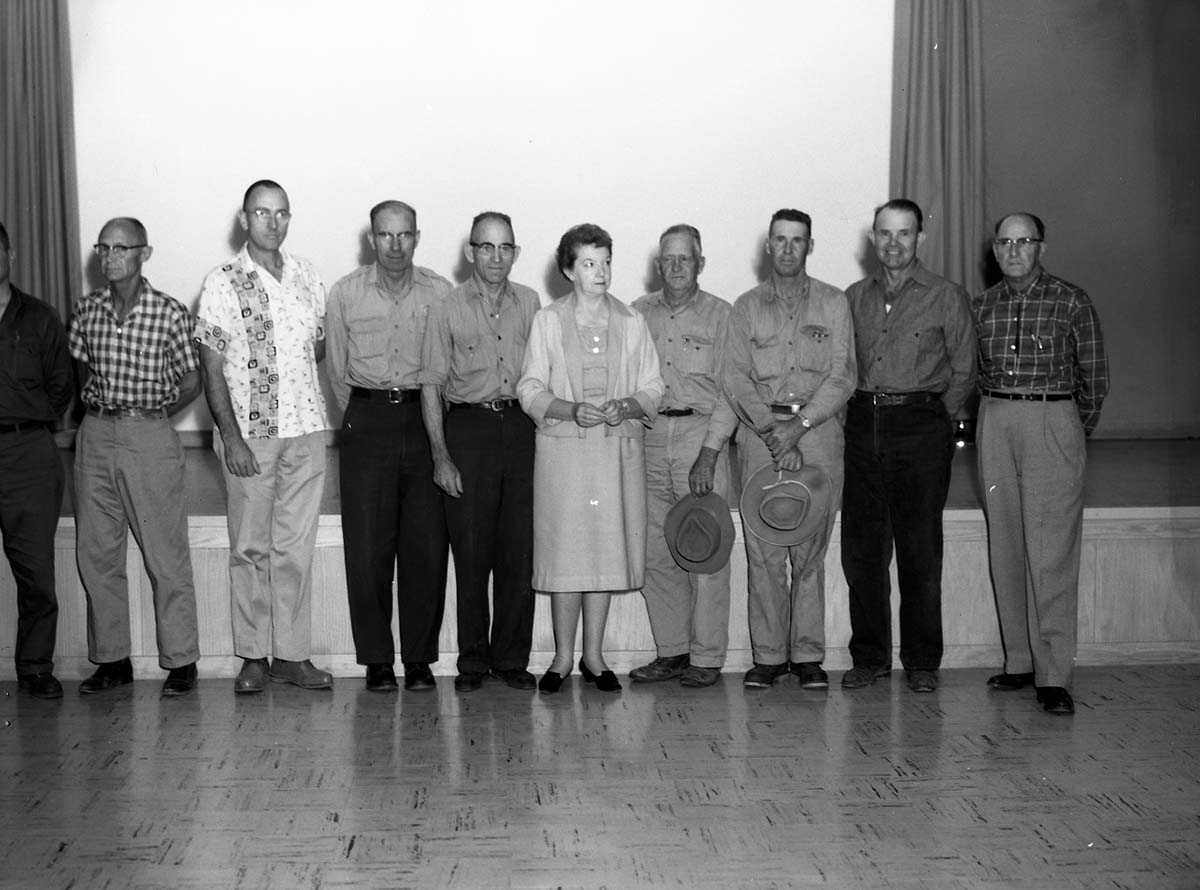 Recipients of Service Awards for 10, 20, and 30 years of service standing in the Mission 66 Visitor Center and Museum auditorium.