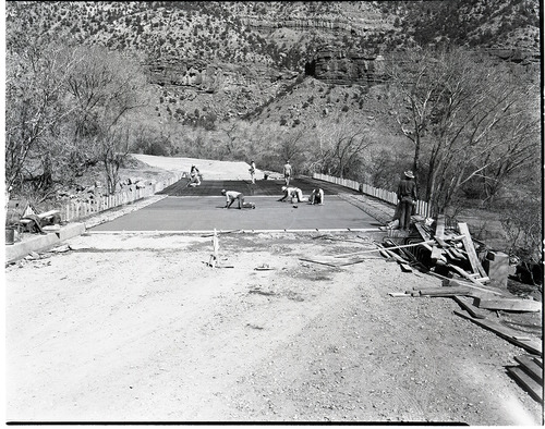 Oak Creek Bridge Construction troweling concrete bed.
