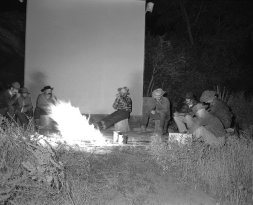 Staff in pioneer costumes performing during campfire program. Campfire Day, September 19, 1957 at the South Campground amphitheater.