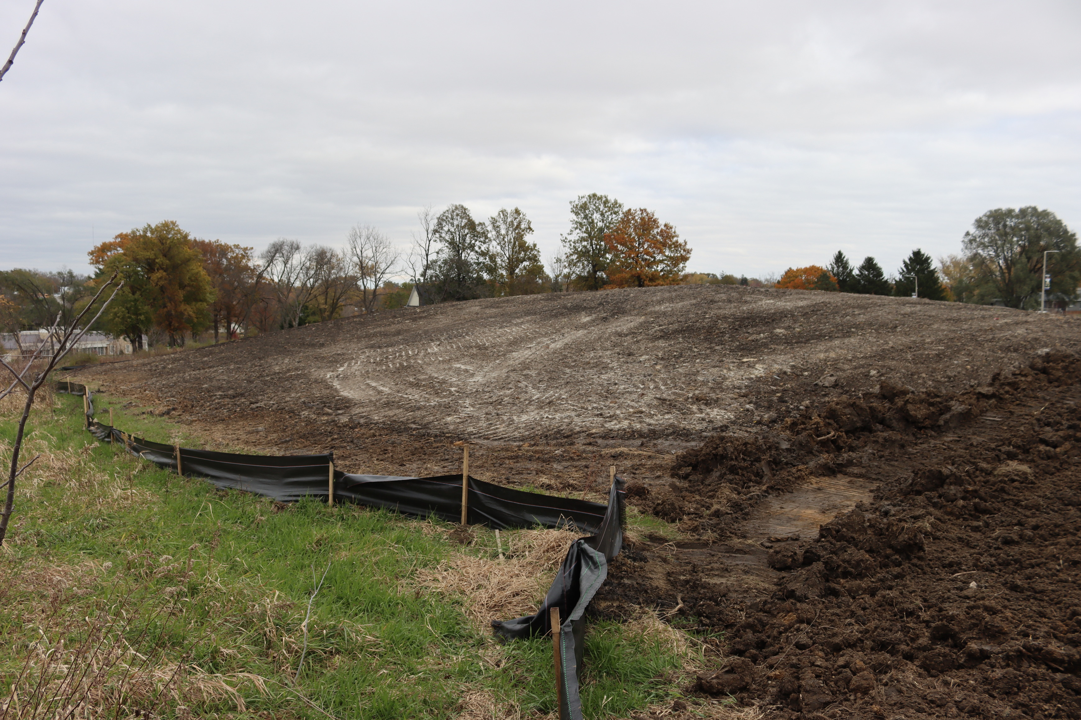 Large pile of sculpted dirt running from the lower right into the distance in the center of the image.