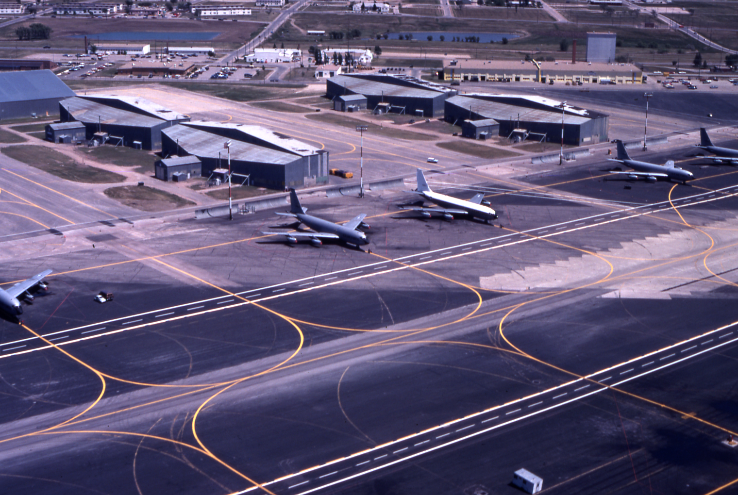 Runway, hangars, and airplanes