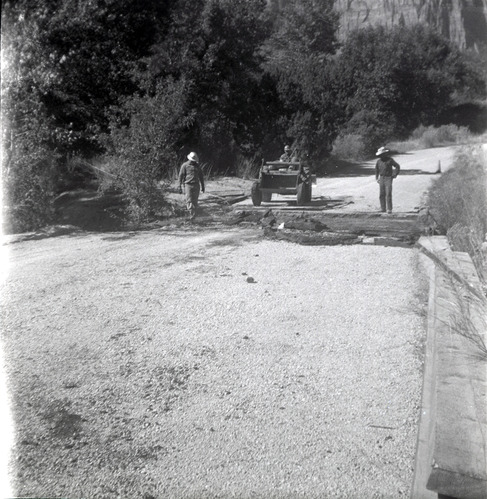 Men repairing section of the road along the scenic canyon drive near the Grotto.