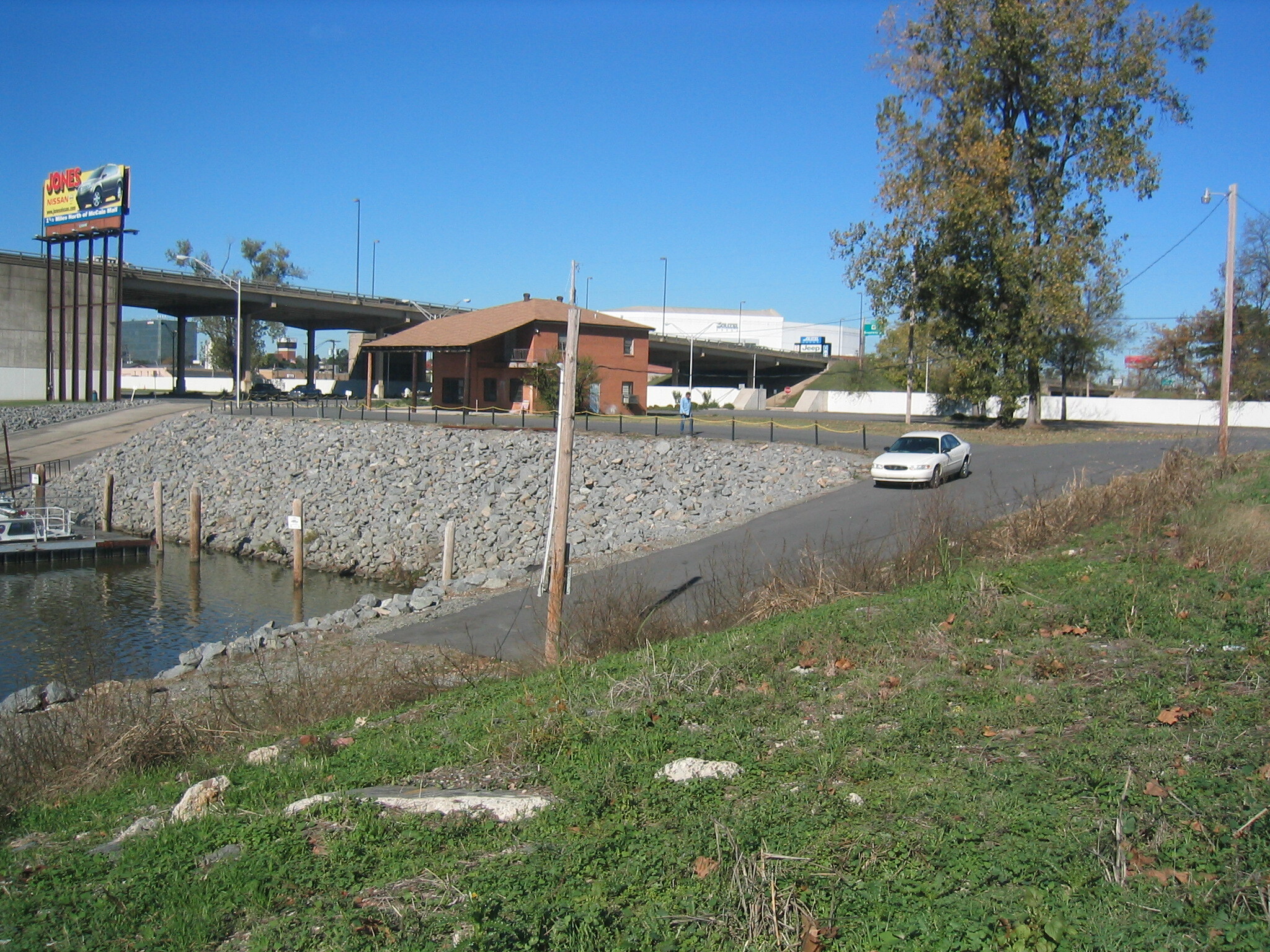 A grassy area next to the water.