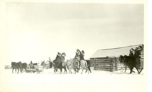 Funeral Procession for Chief Plentycoops; Mounted Men in Traditional Dress and Feathered Headdresses Follow the Casket
