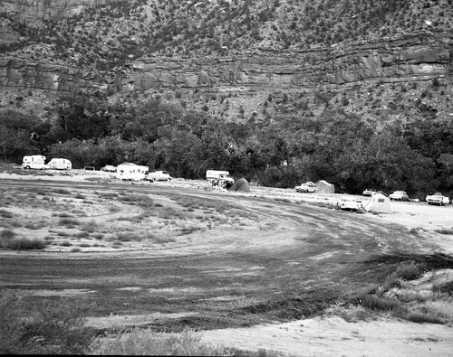 Camper use of overflow area, South Campground overcrowding group area and in gravel mixing area.