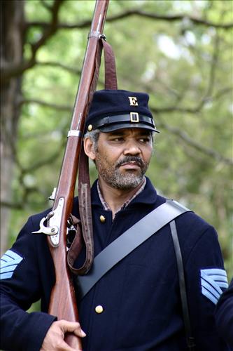 Portaits of Civil War interpreters of U.S. Colored Troops with their rifles at Stones River National Battlefield, April 2004