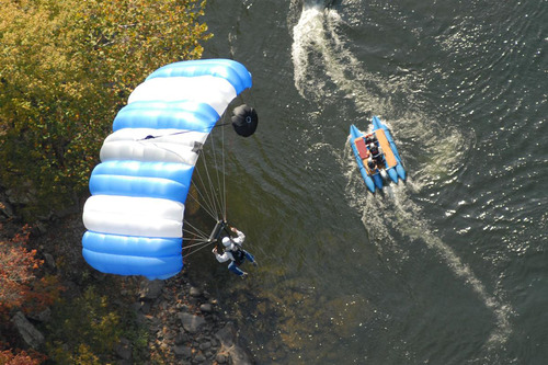 BASE jumper gliding over the river