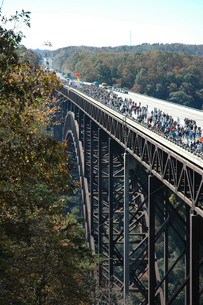 crowds gather on the bridge