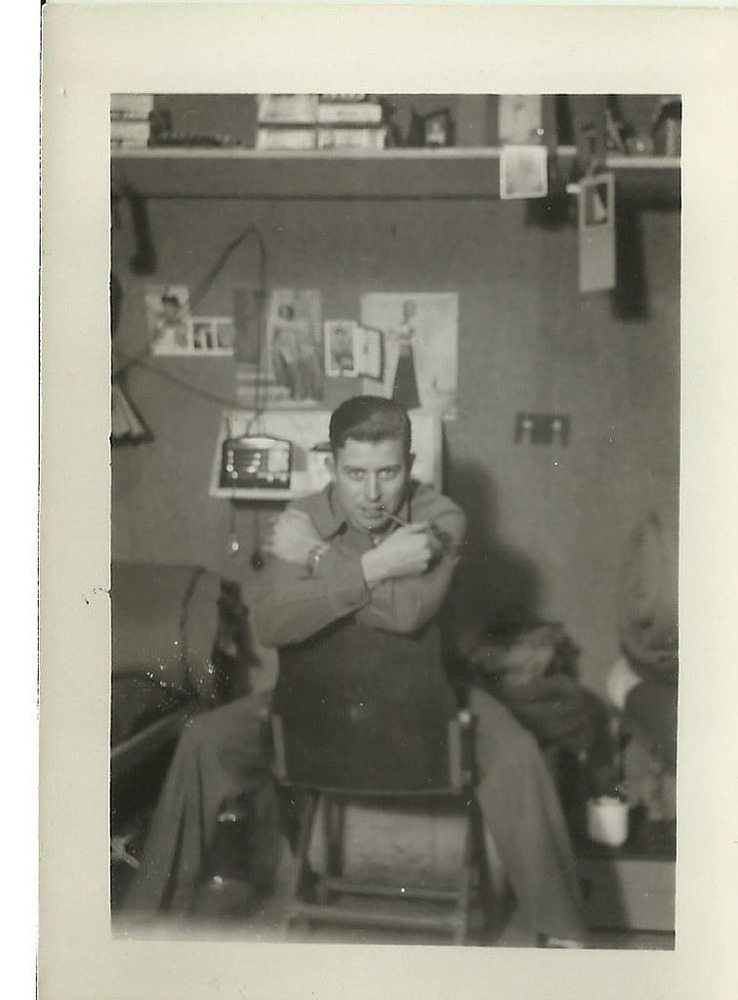 Man sitting backward on a chair