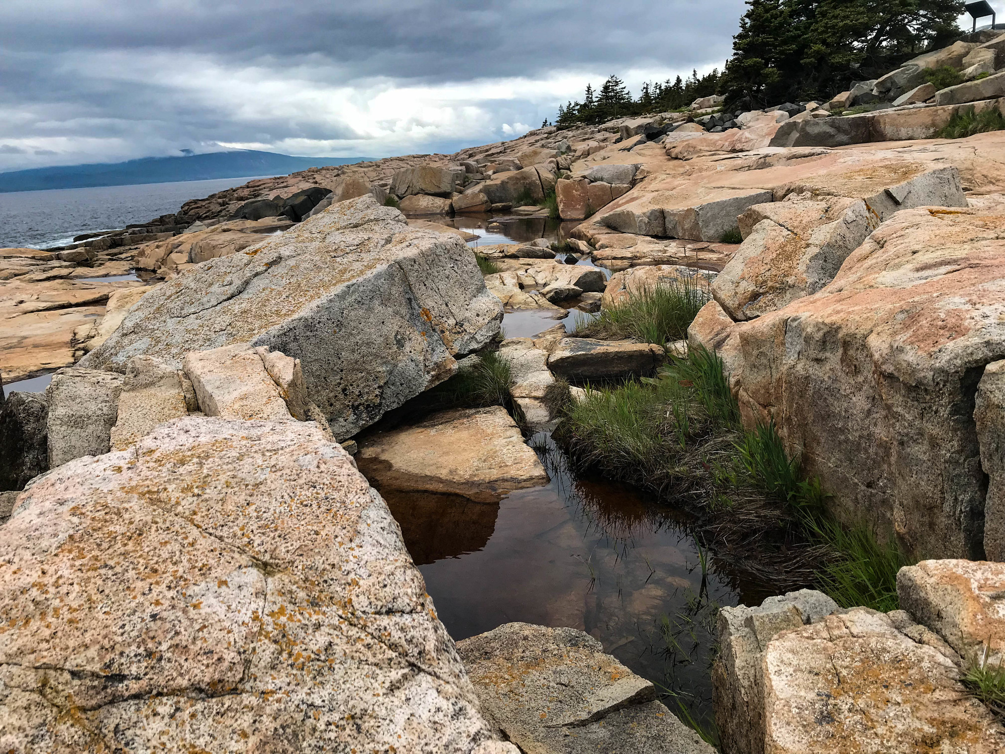 Small water channel on a rocky shoreline