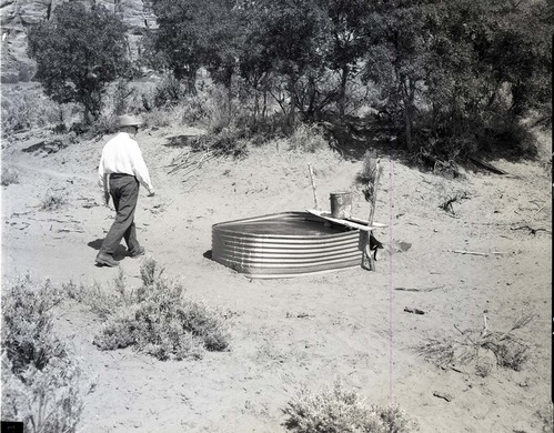 450-gallon water tank on Section 16, T 40S, R 11W, SW 1/4, on state land.