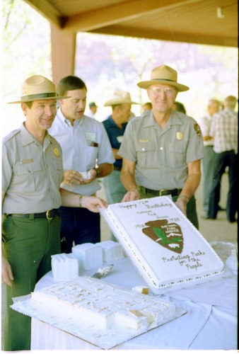 Color Photos of the parks 72nd anniversary celebrations- cake cutting, barbecue, speakers.