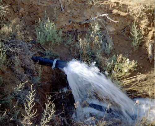 Repainting the exterior of the million gallon water tank at Birch Creek.