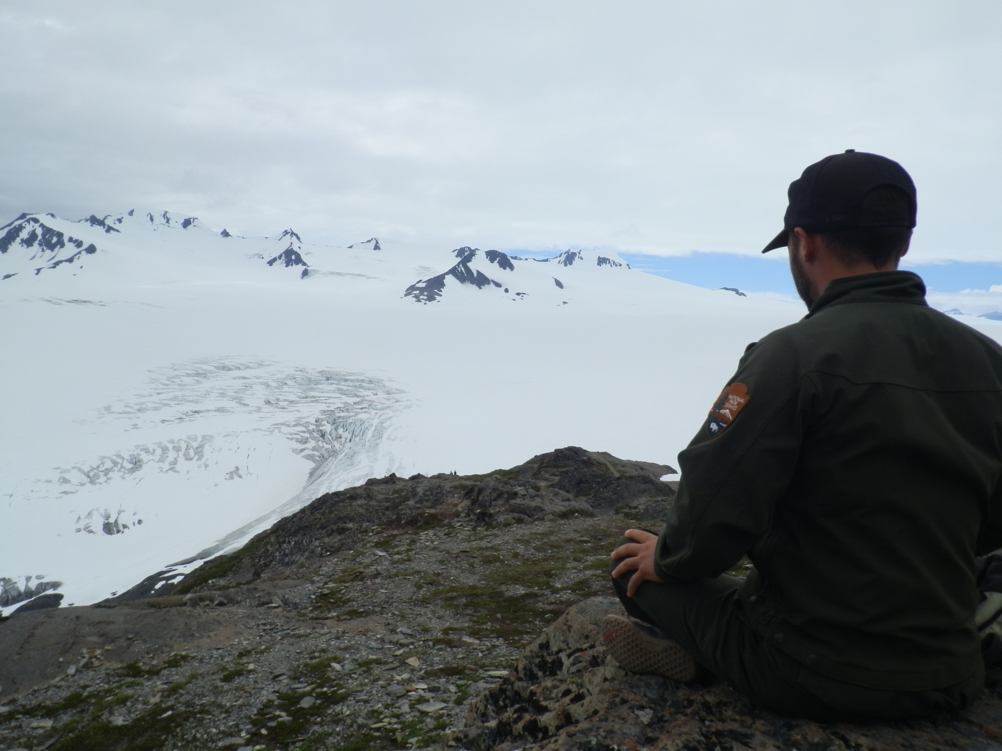 Education Park Ranger Luke Rosier contemplates the Harding Icefield